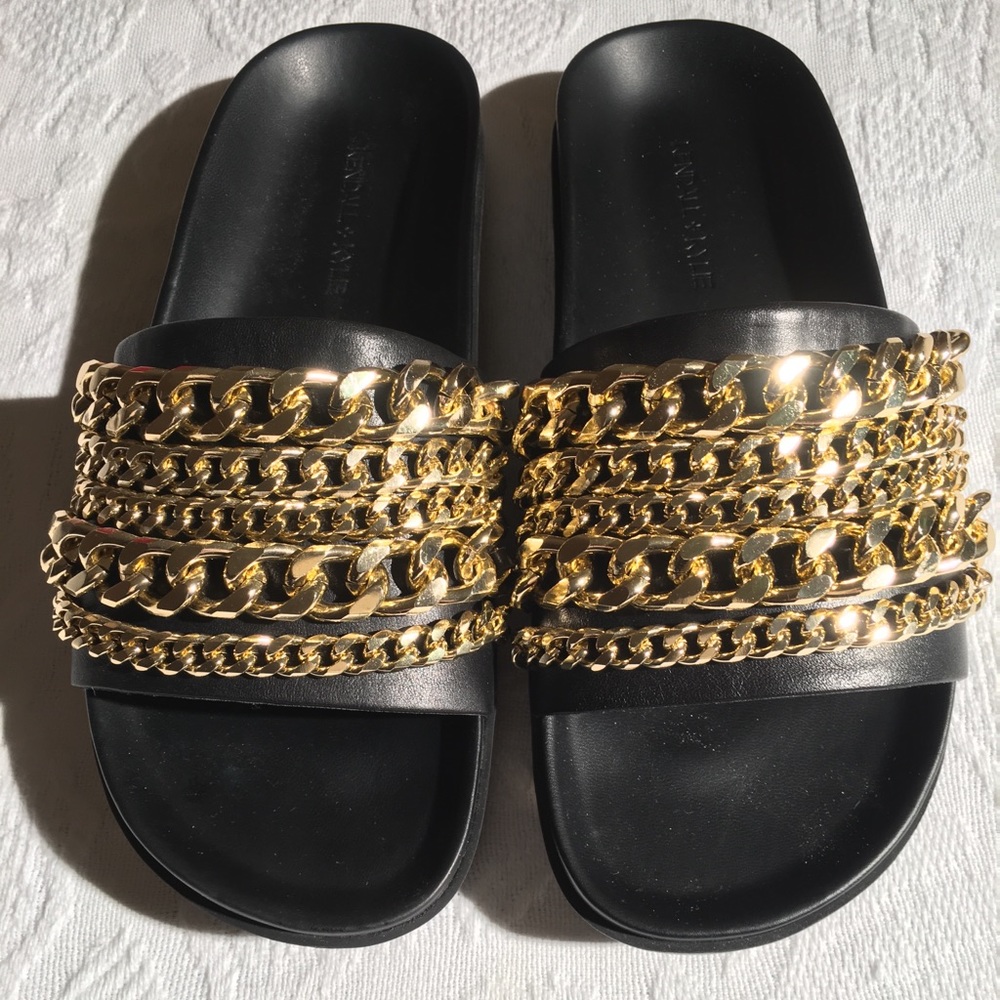 Black leather slides with gold chains